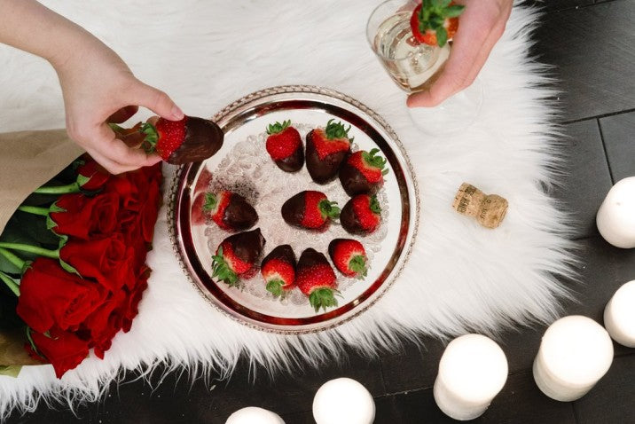 Chocolate Dipped Strawberries on Fur Rug with Candles